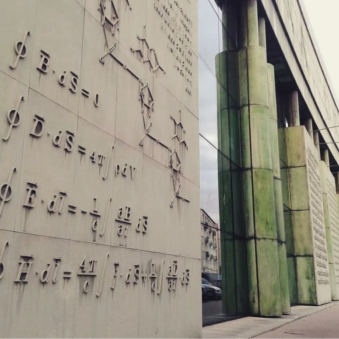 Close view of Maxwell’s equations in stone on the Warsaw physics library